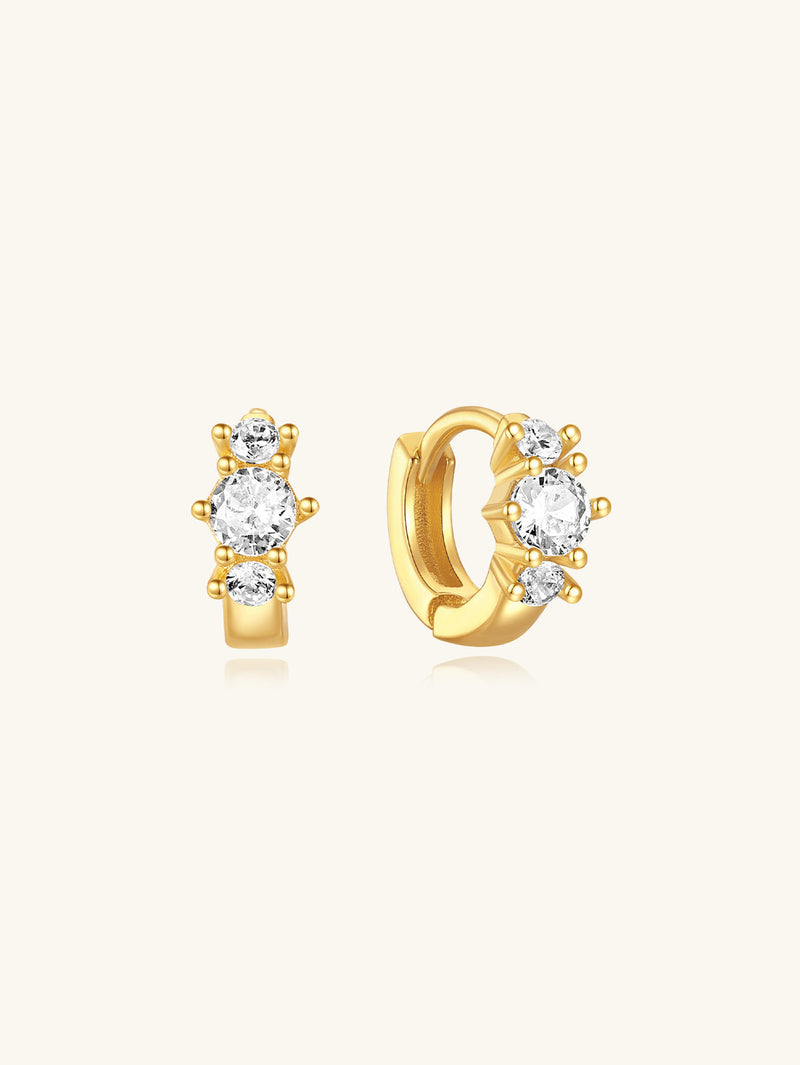 Frieda – Elegant gold earrings with a fun twist.