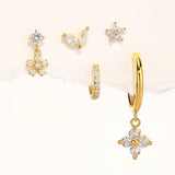 Nora – Elegant gold earrings with a transparent design.