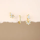 Magda – Delicate gold earrings with a soft shimmer.