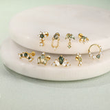 Romina – Gold earrings with a charming playful touch.