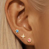 Celine – Gold earrings with filigree design.