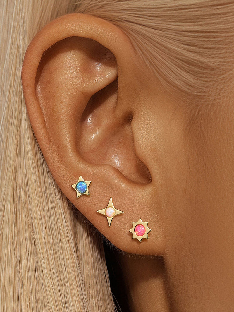 Celine – Gold earrings with filigree design.