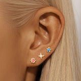 Celine – Gold earrings with filigree design.