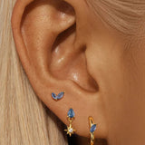Petra – Elegant gold earrings with organic design.