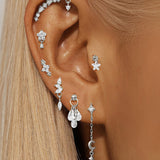 Selina – Elegant gold earrings with a mobile design.