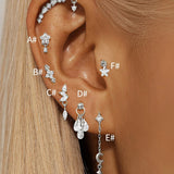 Selina – Elegant gold earrings with a mobile design.