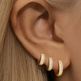 Sina – Gold earrings with a touch of minimalist elegance.