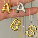 Irena – Gold Necklace with Initial Charm