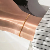 Carina – Gold bracelet with polished platinum finish.