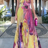 Maxi pleated dress with thin straps, floral print, and fitted waist