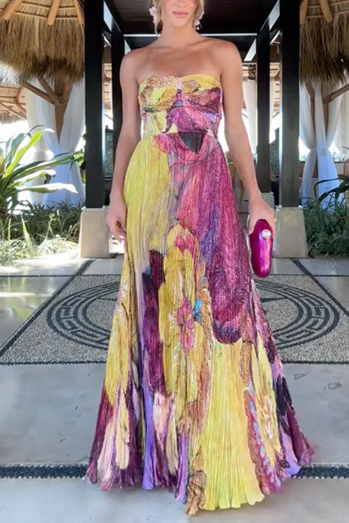 Maxi pleated dress with thin straps, floral print, and fitted waist