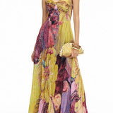 Maxi pleated dress with thin straps, floral print, and fitted waist