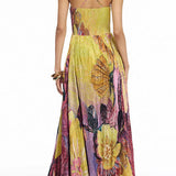 Maxi pleated dress with thin straps, floral print, and fitted waist