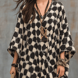 Bohemian-inspired maxi caftan dress with polka dots and loose fit