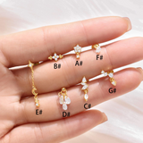 Selina – Elegant gold earrings with a mobile design.