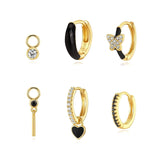 Theresia – Gold earrings with elegant curve.