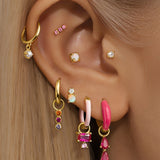 Elena – Gold earrings with textured design.