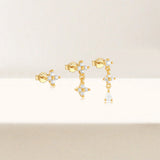 Anika – Gold earrings with elegant movement.