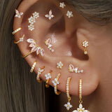 Eva-Marie – Elegant gold earrings with a fluid design.