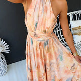 Maxi dress with halter neck and open back, fitted waist, watercolor print