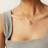 Frieda – Gold necklace with angel wing pendant