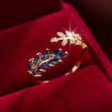 Aurelie – Red gold ring with blue gemstone
