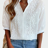 Women's blouse with lace details and puff sleeves