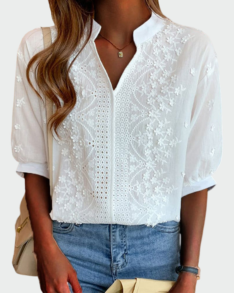 Women's blouse with lace details and puff sleeves