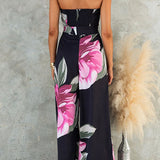 Strapless dress with a knotted waist, wide leg, and floral print