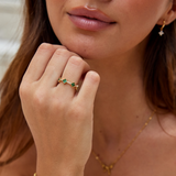 Annika Ring in gold plating with delicate floral details and a touch of emerald.