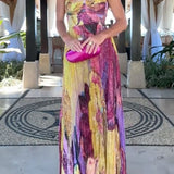 Maxi pleated dress with thin straps, floral print, and fitted waist