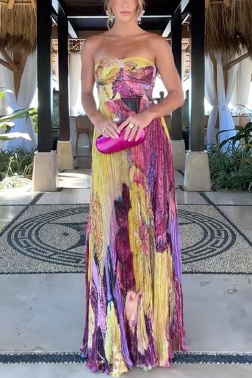 Maxi pleated dress with thin straps, floral print, and fitted waist
