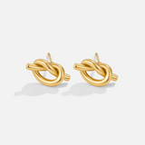 Romina – Intertwined gold earrings.