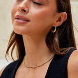Karina – Mini circular gold earrings with an elegant design