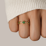 Annika Ring in gold plating with delicate floral details and a touch of emerald.