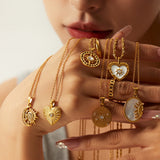 Elisabeth – Gold Necklace with Symbolic Charms