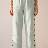 Straight striped pants with side buttons