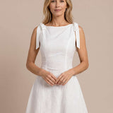 Embroidered short dress with bows