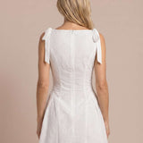 Embroidered short dress with bows