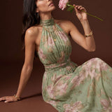 Long dress with halter neck and floral print