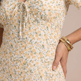 Short floral dress with gathered neckline