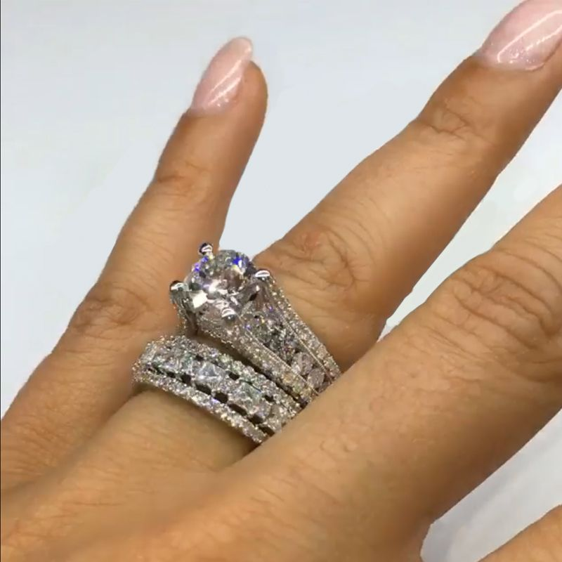 Wide diamond ring with a shiny finish.