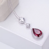 Pia – Pendant with Ruby and Elegant Crystal Frame