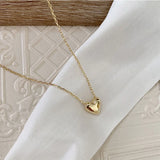 Klara – Gold necklace with circular pendant