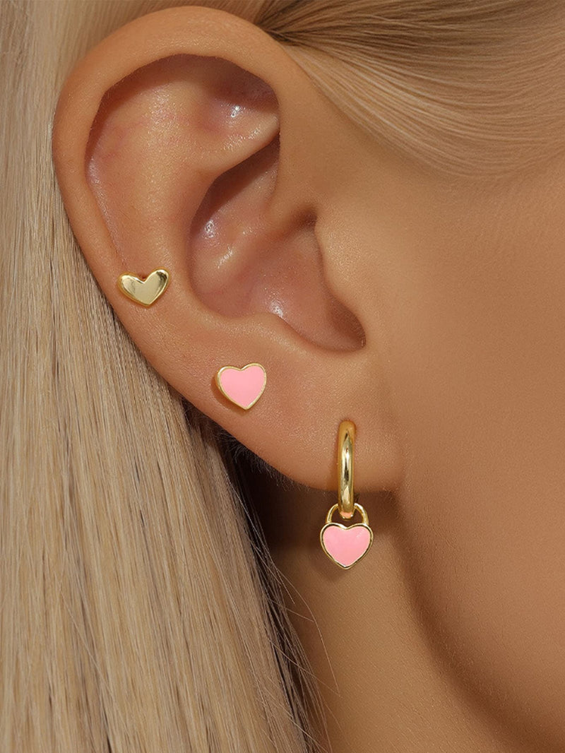 Isolda – Elegant gold earrings with structured design.