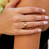 Nora – Gold ring with a curved line design.