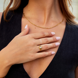 Nora – Gold ring with a curved line design.