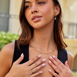 Nora – Gold ring with a curved line design.