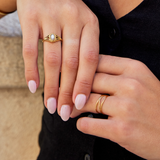 Nora – Gold ring with a curved line design.