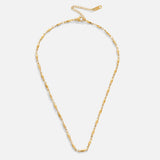Frieda – Golden necklace with a curved pendant